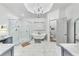 Bright main bathroom featuring dual vanities, a freestanding tub, and a glass shower with a tile surround at 3580 S Sherwood Se Rd, Smyrna, GA 30082