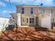 Backyard featuring a small patio, privacy fence, and access door at 11403 S Grove Dr, Hampton, GA 30228