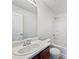 Bathroom with white tiling, vanity and tub with shower at 11403 S Grove Dr, Hampton, GA 30228