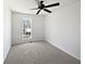 Bedroom featuring a ceiling fan, neutral paint, and carpeted floors at 11403 S Grove Dr, Hampton, GA 30228