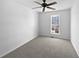 Bedroom featuring a ceiling fan, neutral paint, and carpeted floors at 11403 S Grove Dr, Hampton, GA 30228