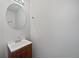 Simple half bath featuring a pedestal sink with vanity at 11403 S Grove Dr, Hampton, GA 30228