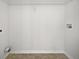 Empty laundry room featuring white walls and tile floor at 11403 S Grove Dr, Hampton, GA 30228