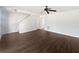 Open living room featuring modern flooring and ceiling fan at 11403 S Grove Dr, Hampton, GA 30228