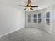 Sun-filled living room with large windows and neutral paint at 11403 S Grove Dr, Hampton, GA 30228