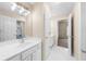 Bright bathroom features a large mirror, white cabinets, and tile flooring at 1416 Elgin Way, Cumming, GA 30041