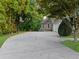 Wide concrete driveway leading to a two-car garage and a basketball hoop on the side at 1416 Elgin Way, Cumming, GA 30041