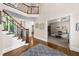 Welcoming foyer with soaring ceiling, hardwood floors, and open staircase to the second floor at 1416 Elgin Way, Cumming, GA 30041