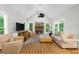 Bright living room with fireplace and vaulted ceiling at 1416 Elgin Way, Cumming, GA 30041