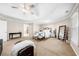 Bright main bedroom with large windows, vaulted ceiling, and a cozy seating area with couch and trunk at 1416 Elgin Way, Cumming, GA 30041