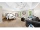 Spacious main bedroom featuring a seating area, neutral walls, and large windows for natural light at 1416 Elgin Way, Cumming, GA 30041