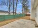 View of backyard featuring a concrete patio and a wooden fence at 1681 Graystone Dr, Hampton, GA 30228