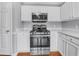 Modern kitchen with stainless steel oven, microwave, white countertops, and cabinets at 1681 Graystone Dr, Hampton, GA 30228