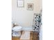 Powder room featuring a toilet, wooden floors, and decorative shelving at 2371 Bellefonte Ave # 61, Lawrenceville, GA 30043