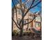 Brick exterior with a staircase leading to the entrance, framed by a large tree at 2371 Bellefonte Ave # 61, Lawrenceville, GA 30043