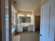 Main bathroom featuring double sinks, soaking tub, and tile floor at 2371 Bellefonte Ave # 61, Lawrenceville, GA 30043