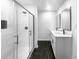 Sleek bathroom featuring double vanity sinks, a glass shower, and modern finishes at 2046 Dellwood Pl, Decatur, GA 30032