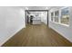 Open living room showcasing hardwood floors and a seamless transition to the updated kitchen at 2046 Dellwood Pl, Decatur, GA 30032