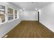 Bright, open-concept living room features beautiful wood floors and natural light at 2046 Dellwood Pl, Decatur, GA 30032