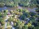 Aerial view of homes surrounded by mature trees near a lake at 427 Picketts Lake Dr, Acworth, GA 30101