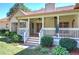 Back porch with a white railing and green bushes at 427 Picketts Lake Dr, Acworth, GA 30101