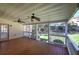 Covered porch with ceiling fans overlooking landscaped backyard at 427 Picketts Lake Dr, Acworth, GA 30101