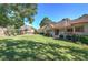 Backyard featuring manicured lawn, trees, and seating at 427 Picketts Lake Dr, Acworth, GA 30101