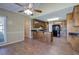 Open kitchen and dining area with beautiful hardwood floors, granite countertops, and natural lighting at 427 Picketts Lake Dr, Acworth, GA 30101