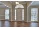 Bright foyer featuring hardwood floors and a classic front door with sidelights at 427 Picketts Lake Dr, Acworth, GA 30101