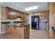 Kitchen featuring granite countertops, an island with storage, tile backsplash, and stainless steel appliances at 427 Picketts Lake Dr, Acworth, GA 30101