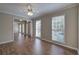 Living room with hardwood floors, neutral walls, and large windows providing natural light at 427 Picketts Lake Dr, Acworth, GA 30101