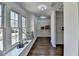 Bright, spacious closet with hardwood floors, a window seat and custom shelving for optimal storage at 4634 Meadow Bluff Ln, Suwanee, GA 30024