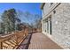 Wood deck features decorative railings and views of the backyard, and brick siding at 4634 Meadow Bluff Ln, Suwanee, GA 30024