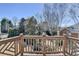 View from the deck looking out onto the green scenery and the blue sky at 4634 Meadow Bluff Ln, Suwanee, GA 30024