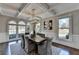 Dining room with coffered ceilings, hardwood floors, and ample natural light creating a welcoming atmosphere at 4634 Meadow Bluff Ln, Suwanee, GA 30024