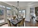 Bright dining area with outdoor access to a wood deck at 4634 Meadow Bluff Ln, Suwanee, GA 30024