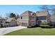 Beautiful home featuring three-car garage, well-maintained lawn, and attractive architectural details at 4634 Meadow Bluff Ln, Suwanee, GA 30024