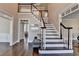 Spacious foyer with hardwood flooring, staircase, and natural light, offering a welcoming entrance at 4634 Meadow Bluff Ln, Suwanee, GA 30024