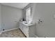 Bright laundry room featuring white cabinets, neutral walls, durable flooring, and a window providing natural light at 4634 Meadow Bluff Ln, Suwanee, GA 30024