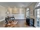 Stylish home office featuring wainscoting, natural light, hardwood floors and a sophisticated design at 4634 Meadow Bluff Ln, Suwanee, GA 30024