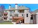 Exterior with multi-level decks and patios at 4634 Meadow Bluff Ln, Suwanee, GA 30024