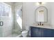 Modern bathroom with a glass-enclosed shower, stylish vanity, and contemporary fixtures at 165 Cedarwood Ln, Roswell, GA 30075