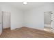 Hardwood floors provide a foundation for this bright space with doors leading to other rooms at 165 Cedarwood Ln, Roswell, GA 30075
