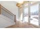 Bright foyer featuring hardwood floors, modern railing staircase, and natural light from the front door at 165 Cedarwood Ln, Roswell, GA 30075