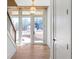 Entryway with hardwood floors, wooden ceiling detail, and modern lighting fixture at 165 Cedarwood Ln, Roswell, GA 30075