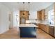 Elegant kitchen with island and stylish cabinetry, designed for both cooking and entertaining at 165 Cedarwood Ln, Roswell, GA 30075
