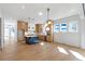 Open-concept kitchen and living area, featuring a kitchen island and bright natural light at 165 Cedarwood Ln, Roswell, GA 30075