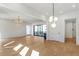 Open-concept living room with modern lighting and sliding glass doors, blending indoor and outdoor spaces at 165 Cedarwood Ln, Roswell, GA 30075