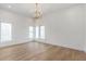 Bright open living room with multiple windows and hardwood floors at 165 Cedarwood Ln, Roswell, GA 30075