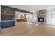 Open-concept living room featuring a stone fireplace and custom built-in storage at 165 Cedarwood Ln, Roswell, GA 30075